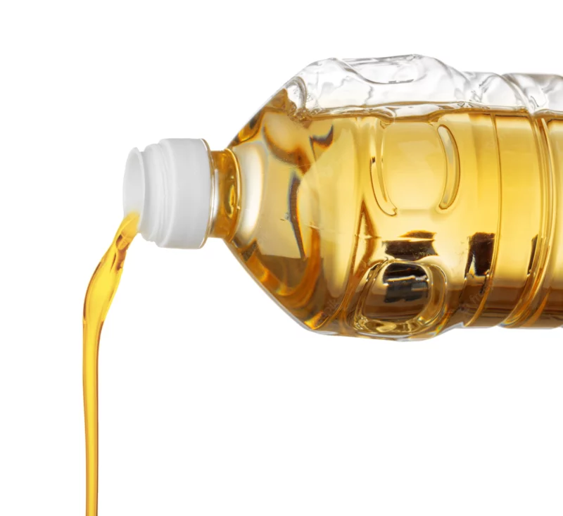sunflower-oil-pouring-from-bottle-isolated-white-background_93675-89012